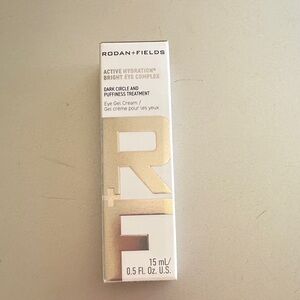 Rodan + Fields Bright Eye Complex in White and Gold Accents